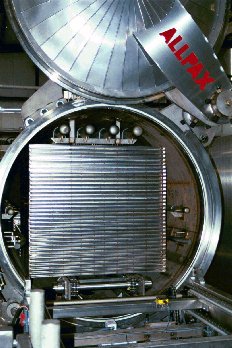 Internal conveyors assist with automated basket loading and unloading.